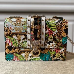 Small unique handbag with a jungle vibe.  Purchased at upscale boutique.